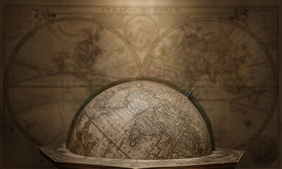 Wall Mural - Old geographical globe on map background. Science, education, travel, vintage background. History and geography team. Ancience, antique globe on the background of books.