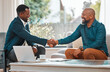 © N Lawrenson/peopleimages.com - Broker, handshake and black man in a house with a client for meeting or consultation for agreement. Financial advisor shaking hands with happy person for investment, savings budget or insurance deal