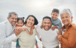 © Kirsten D/peopleimages.com - Happy family, smile portrait and beach with grandparents, parent love and kids together by sea. Outdoor, vacation and children with grandmother and father by the ocean on holiday in group with travel