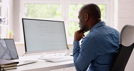 Fototapete - Computer Programmer Writing Program Code On Computer