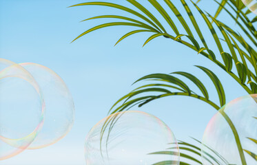 Poster - Soap bubbles with tropical plants on blue sky background. 3d rendering