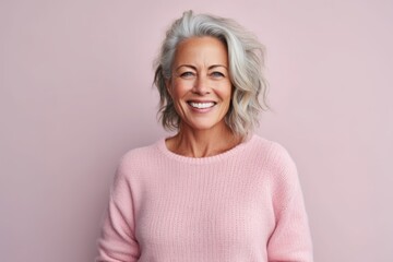 Wall Mural - Medium shot portrait photography of a pleased woman in her 50s that is wearing a cozy sweater against a pastel or soft colors background . Generative AI