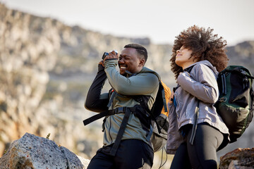 hiking, camera and photographer with couple in mountains for journey, climbing and travel. relax, tr