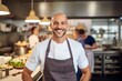 © Robert MEYNER - Medium shot portrait photography of a grinning man in his 30s that is wearing a chic cardigan against a well-stocked gourmet kitchen with a chef at work background . Generative AI