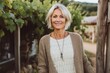© Anne-Marie Albrecht - Medium shot portrait photography of a pleased woman in her 50s that is wearing a chic cardigan against a picturesque vine-covered cottage in the countryside background . Generative AI