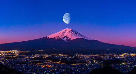 beautiful aerial view of Mount Fuji with a big moon above