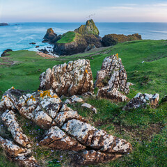 Wall Mural - Beauitful sunrise and sunset landscape image of Kynance Cove in Cornwall England with colourful sky