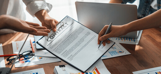Poster - Panorama shot hand signing signature on legal contract, business report and BI Fintech paper on table. Seal business agreement deal with signature. Investment loan for startup company. Scrutinize