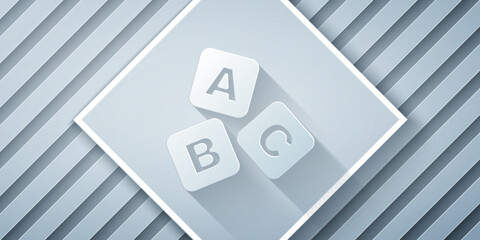 Wall Mural - Paper cut ABC blocks icon isolated on grey background. Alphabet cubes with letters A,B,C. Paper art style. Vector