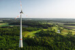 Wind turbine in the early morning sunrise seen from an aerial view