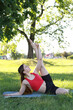 © Olga - Woman doing yoga in the park