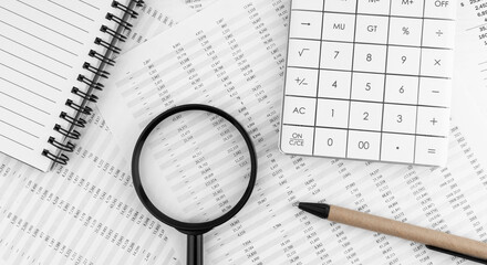 Poster - Calculator, magnifying glass, pen lying and notebook on financial statement. Financial concept. Top view.