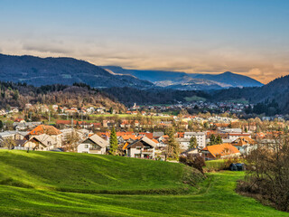 Poster - Kamnik village, lush green grass field and mountain during sunset, Kamnik, Slovenia