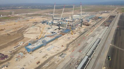 Wall Mural - Aerial drone rotation view of the construction site of the new Western Sydney International Airport at Badgerys Creek in Western Sydney, NSW, Australia looking east turning south in June 2023    