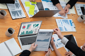 Poster - Top-view closeup business team of financial data analysis meeting with business intelligence, report paper and dashboard on laptop. Business group people working together in harmony office.