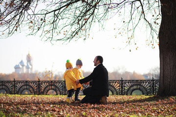 Wall Mural - Children walk in the autumn park