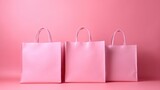 Fototapeta Dinusie - Pink shopping bags. Pink background.