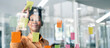 © NAMPIX - Happy black businesswoman planning new porject with sticky note in a creative office