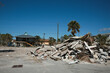 Destroyed Houses and Piles of Rubble after Hurricane Ian in Fort Myers Florida Sea Front, USA