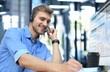 © ty - Smiling friendly handsome young male call centre operator