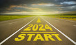 2024 lettering on empty asphalt road. Road in the countryside going straight. 2024 new year start goals concept