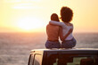 © Matthew Cerff/peopleimages.com - Love, gay and sunset with lesbian couple on car beach for relax, romance and sky mockup space. Lgbtq, freedom and pride with women hugging on nature date for partner, trust and summer vacation