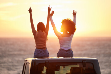 sunset, women sitting on a car and at the beach with back view for carefree or peace. freedom or adv