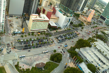 Aerial view of heavy traffic on urban street in downtown office district of Miami Brickell in Florida, USA. High commercial and residential skyscraper buildings in modern american megapolis