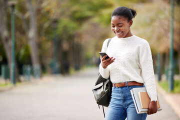 Wall Mural - Phone, books and mockup with a student black woman on her commute to university campus for education. Mobile, social media and schedule with a female college pupil checking for her next lecture