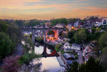 Stone Viaduct Over River Nidd At Knaresborough With Rowing Boats By Riverbank