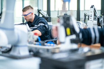 Mechanical engineering team working in robotic technology lap for research and develop for manufacturing automation and robotics.