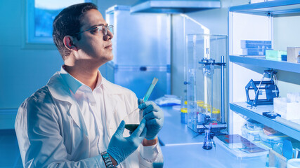 Poster - man is chemist. laboratory assistant with test tube thought. scientist at start center. indian guy w