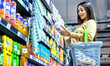 © Anela Ramba/peopleimages.com - Grocery, shopping and wow with woman in supermarket for food, retail or label reading. Product, nutrition and health with female customer and basket in store for diet, discount and sale coupon