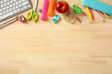 Wall Mural - Frame border of school supplies on wooden table. Education, Back to school concept.