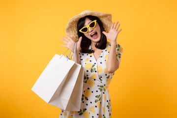 portrait happy attractive young asian woman with trendy springtime dress, hat, sunglasses fashion an