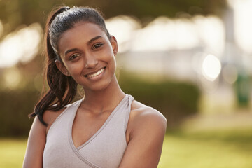 Wall Mural - Woman, portrait and fitness outdoor of a Indian female person with a smile from exercise. Workout, mockup and sport of a runner athlete in nature for health, training and wellness with happiness