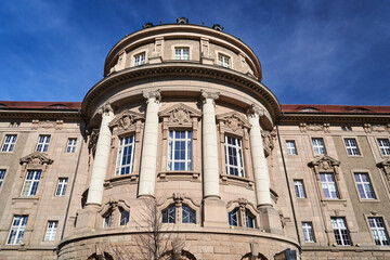 Poster - The facade of a historic building in the neoclassical style with windows and columns in the city of Poznan