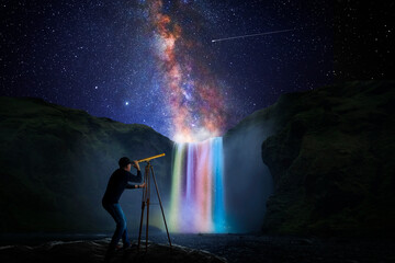 Wall Mural - man observing the universe through a telescope