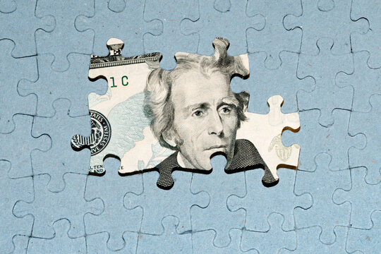Wall Mural - US dollar banknote under unfinished puzzle, bank crisis concept, US default, currency wars
