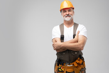 Wall Mural - portrait of mature happy handyman isolated on white background.