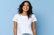 Young woman wearing bella canvas white shirt mockup, at blue background. Design tshirt template, print presentation mock-up. AI generated.