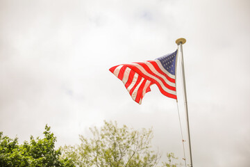 Wall Mural - US flag: a symbol of patriotism, national identity, freedom, and the commemoration of American holidays like Memorial Day and July Fourth