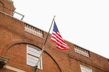 Wall Mural - US flag: a symbol of patriotism, national identity, freedom, and the commemoration of American holidays like Memorial Day and July Fourth