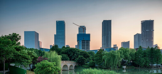 Wall Mural - Modern cityscape behind in situ woods