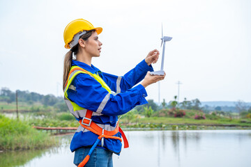 Poster - Engineer inspection and survey work in wind turbine farms rotation to generate electricity energy.