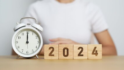 Wall Mural - Happy New Year with vintage alarm clock and flipping 2023 change to 2024 block. Christmas, New Start, Resolution, countdown, Goals, Plan, Action and Motivation Concept