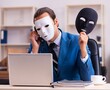 © Elnur - Young male employee wearing masks in the office