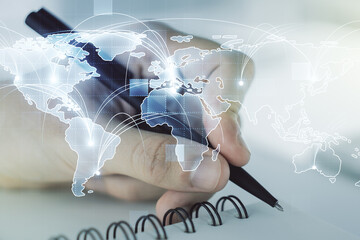 Poster - Abstract graphic digital world map with connections and man hand writing in diary on background, globalization concept. Multiexposure