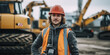 Portrait of a beautiful construction worker with a helmet in front of the excavator