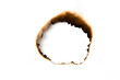 © Nattapol_Sritongcom - burnt holes in a piece of paper isolated on white background
